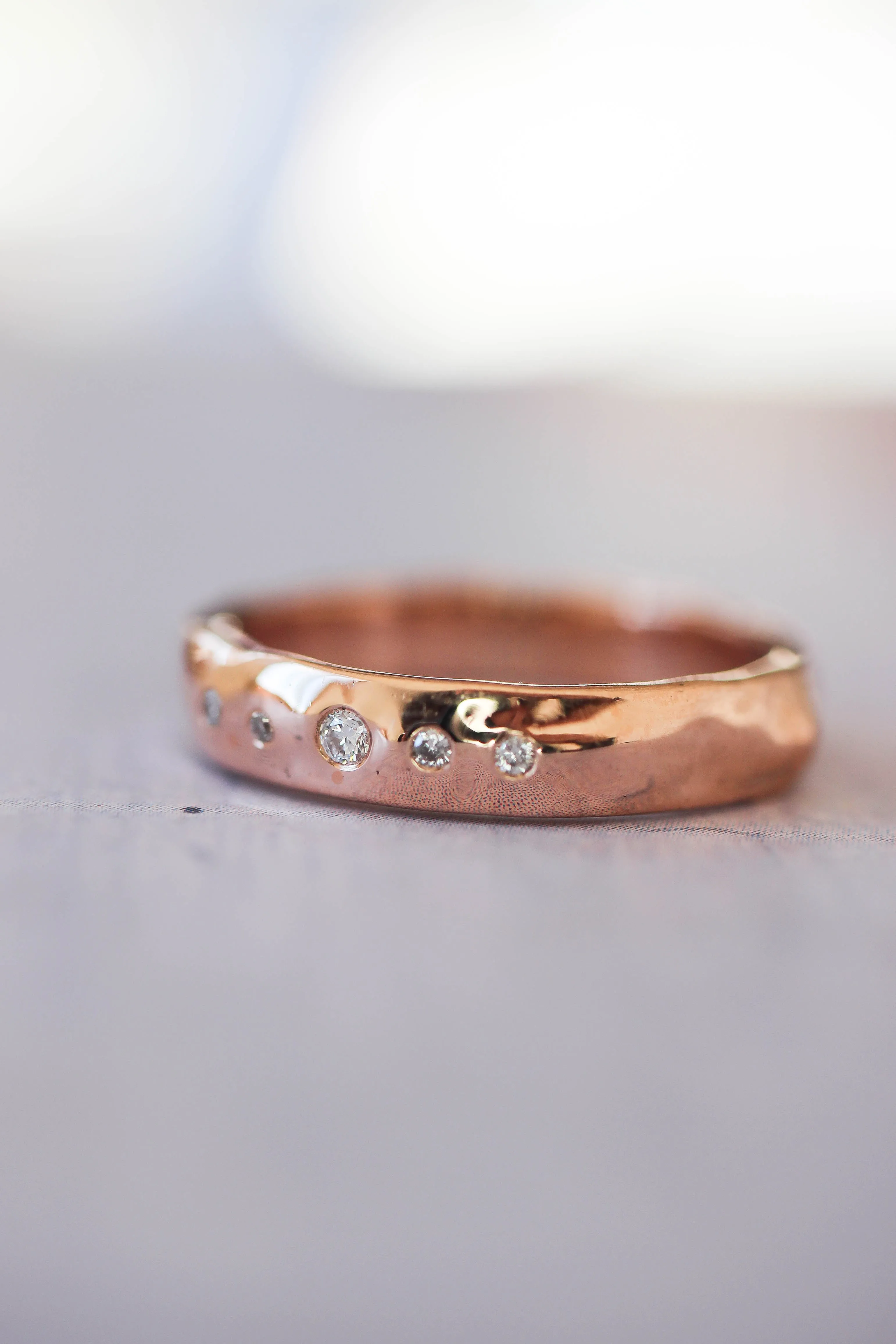 Organic wedding band with five diamonds, unisex ring