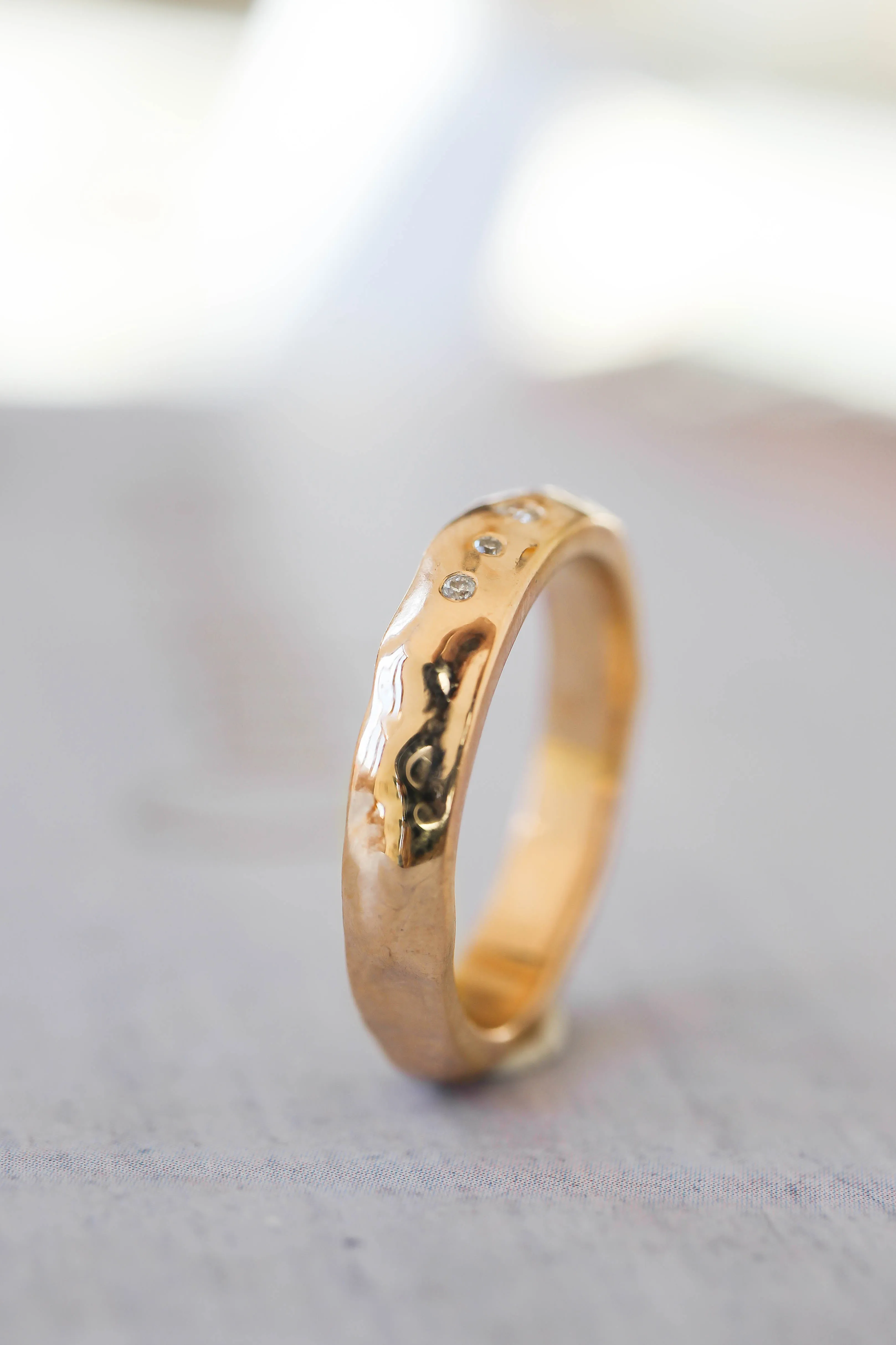 Organic wedding band with five diamonds, unisex ring