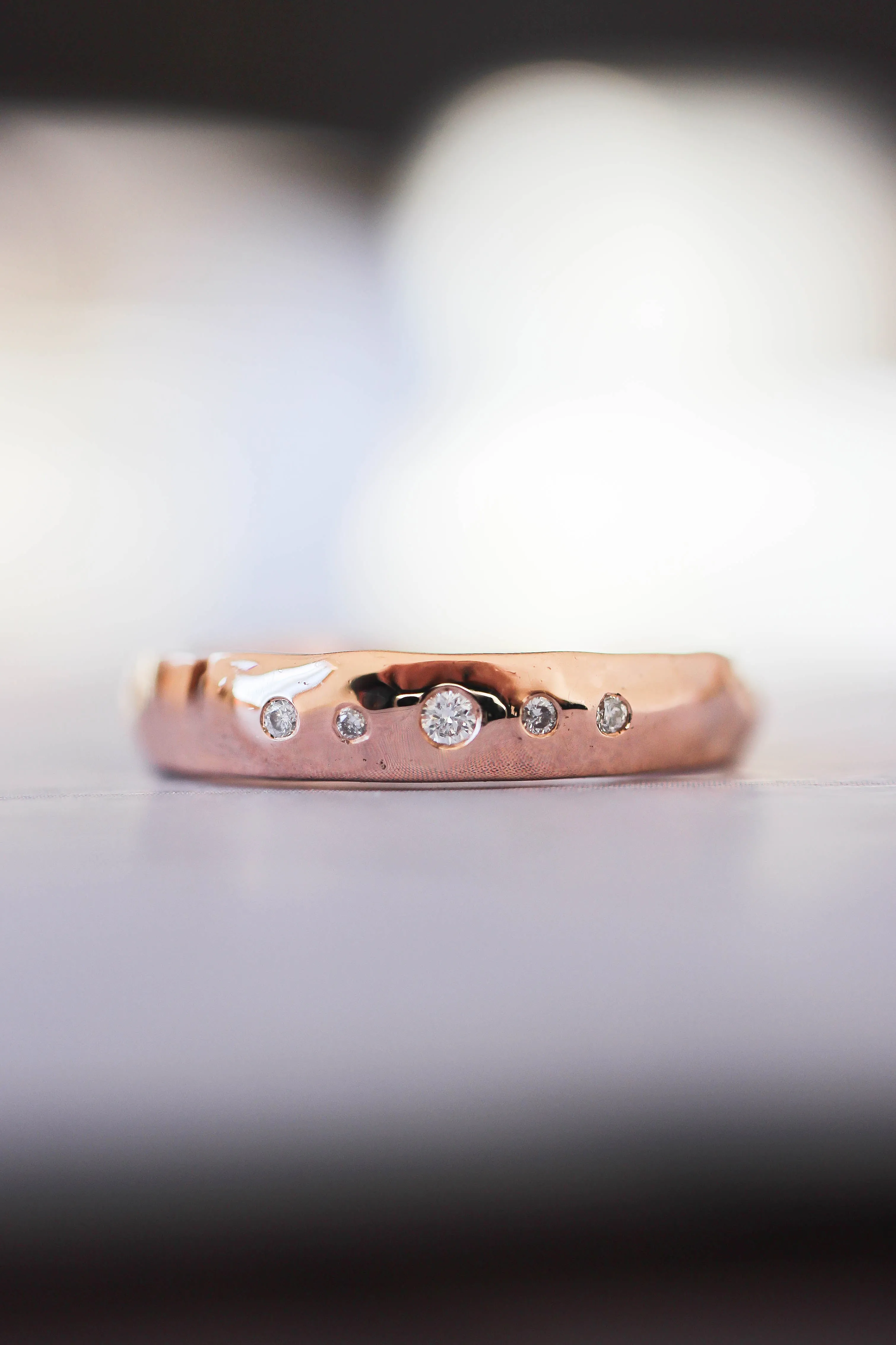 Organic wedding band with five diamonds, unisex ring